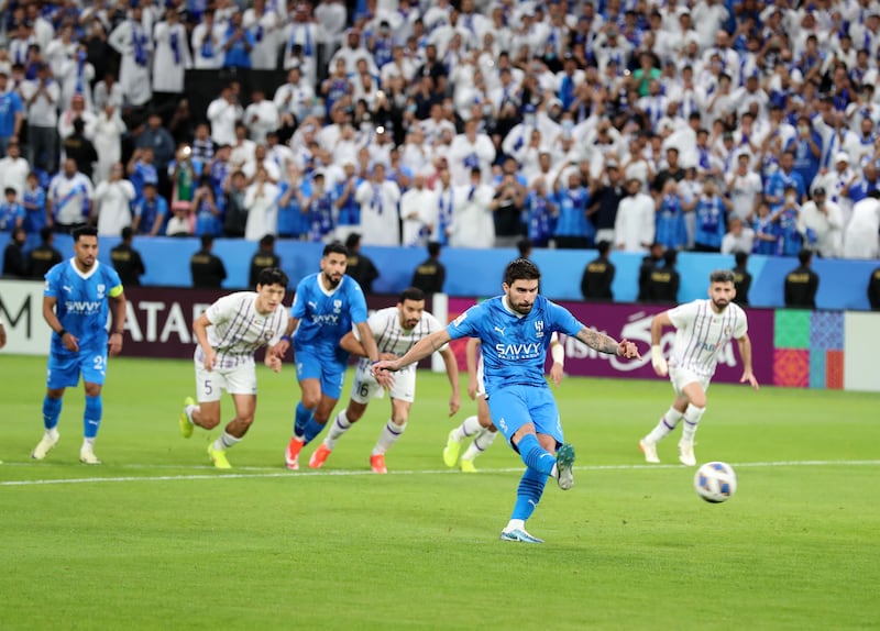 Al Hilal's Ruben Neves scores their first goal from the penalty spot.