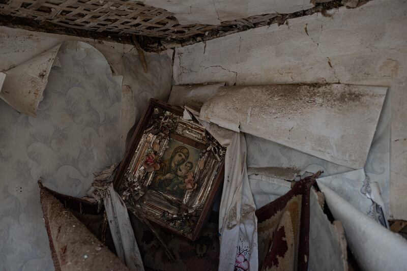A damaged Orthodox icon is seen in the corner of local resident Yurii's heavily damaged house in Fenevychi, Ukraine. Getty Images