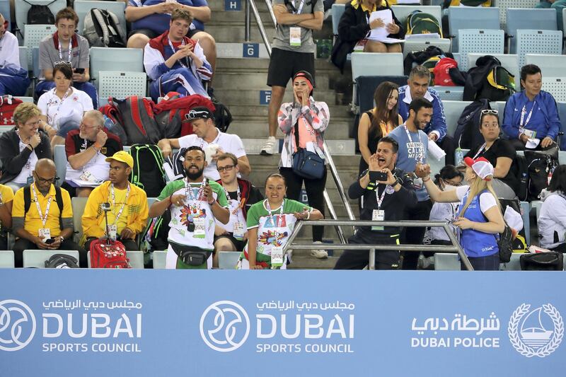DUBAI , UNITED ARAB EMIRATES , March 20 – 2019 :- Spectators watching the 4x50m freestyle relay at the Special Olympic games held at Hamdan Sports Complex in Dubai. ( Pawan Singh / The National ) For News/Instagram/Online/Big Picture . Story by Ramola