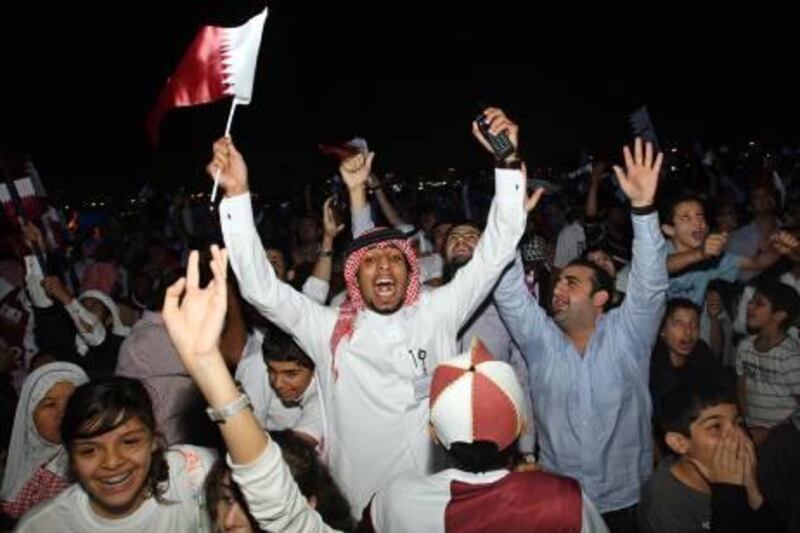 epa02476980 Qatari soccer fans celebrate in the streets following the announcement that Qatar will host the 2022 Soccer World Cup in Doha, Qatar, 02 December 2010. Qatar will host the 2022 World Cup after a vote by FIFA's executive committee. The decision was announced in Zurich by Joseph S. Blatter, the president of football's world governing body.  EPA/MOHAMED FARAG *** Local Caption ***  02476980.jpg