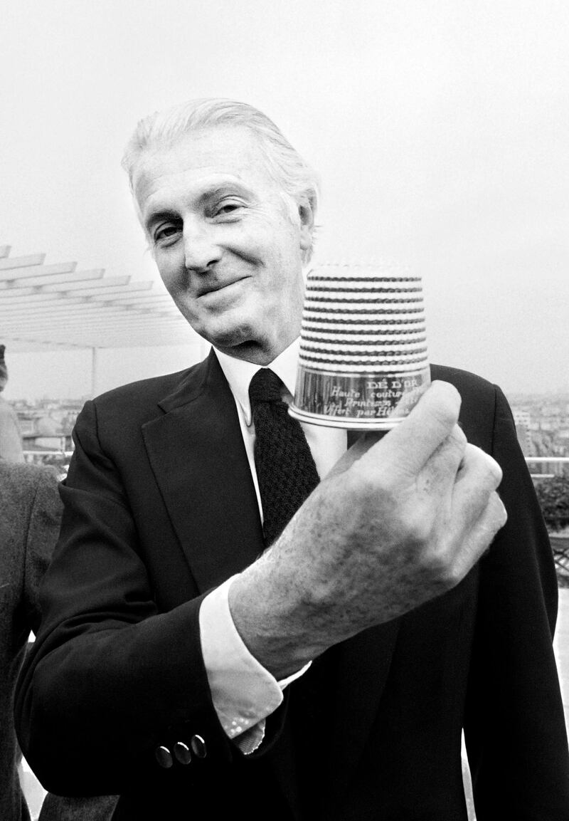 In this file photo taken on January 28, 1982 French aristocrat and fashion designer Hubert de Givenchy poses with the Golden Thimble award of French Fashion in Paris. AFP