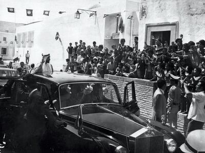 Sheikh Zayed waves to crowds greeting him on a visit. Courtesy National Archives