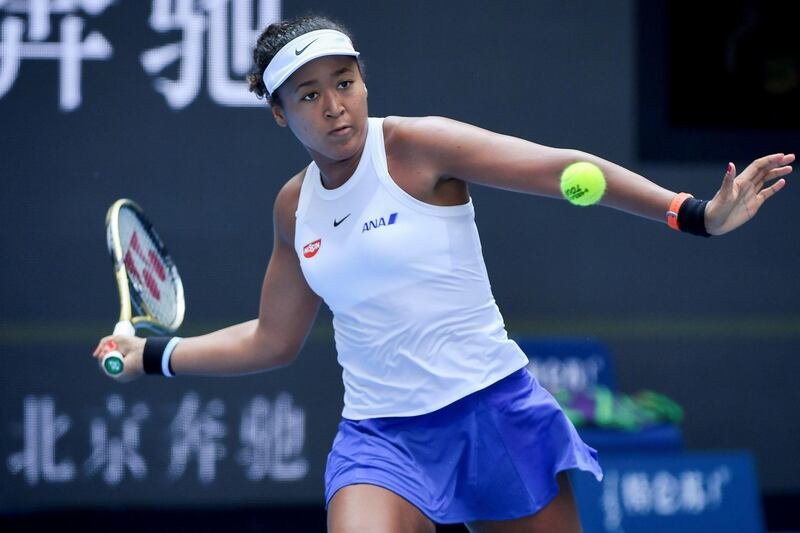 Naomi Osaka of Japan hits a return against Jessica Pegula of the US in their women's singles first round match at the WTA China Open tennis tournament in Beijing on September 29, 2019. / AFP / WANG ZHAO
