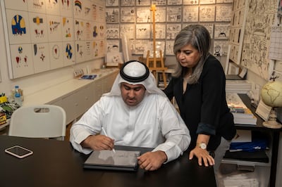 Emirati artist Abdulla Lutfi and art teacher Gulshan Kavarana in his studio space at Tashkeel in Dubai. Antonie Robertson / The National
