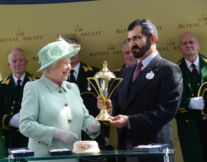 Mandatory Credit: Photo by Hugh Routledge/Shutterstock (1752055ae)
Queen Elizabeth II presents Sheikh Mohammed bin Rashid Al Maktoum with his owner's trophy after Godolphin won The Gold Cup
Royal Ascot race meeting, Ladies Day, Berkshire, Britain - 21 Jun 2012