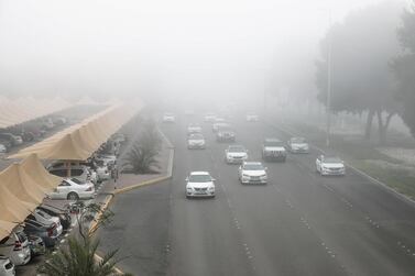 Early morning fog on Muroor Road in January. Police in the capital reduce the speed limit of motorways if visibility is low. Victor Besa / The National 