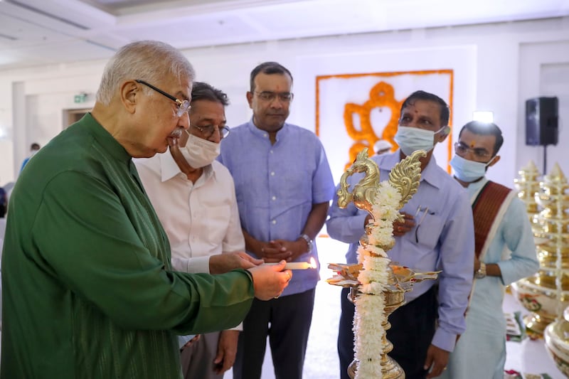 Trustees and guests light a candle at the ceremony for the Hindu temple at Jebel Ali, which is scheduled to open in October.