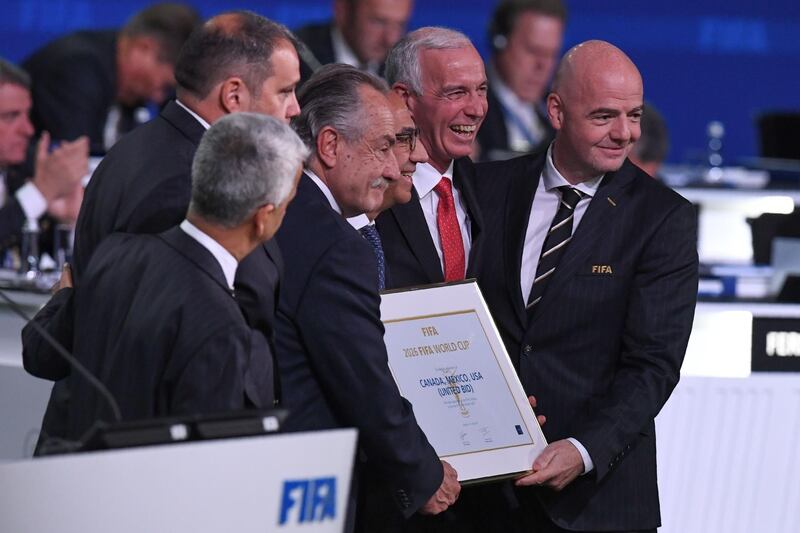 FIFA president Gianni Infantino, right, poses with the United 2026 bid (Canada-Mexico-US) officials Carlos Cordeiro, third right, president of the United States Football Association, president of the Mexican Football Association Decio de Maria Serrano, third left, Steve Reed, second right, president of the Canadian Soccer Association, following the announcement of the 2026 World Cup host during the 68th FIFA Congress at the Expocentre in Moscow, Russia, on June 13, 2018. Kirill Kudryavtsev / AFP