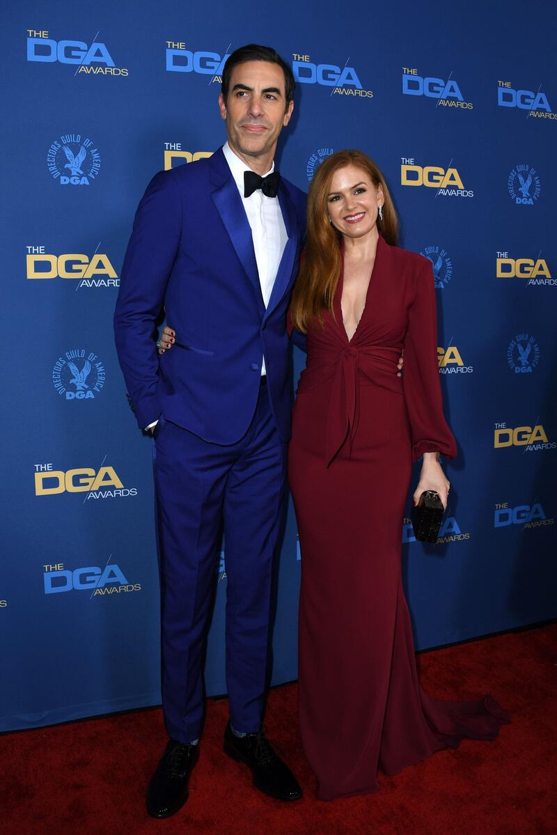 Sacha Baron Cohen and Isla Fisher at the DGAs. Fisher wore a Reem Acra dress with Christian Louboutin shoes and Beladora earrings, with an Edie Parker bag. AFP