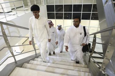 A group of students climb the stairs at a college in Qassim, Saudi Arabia. Bloomberg