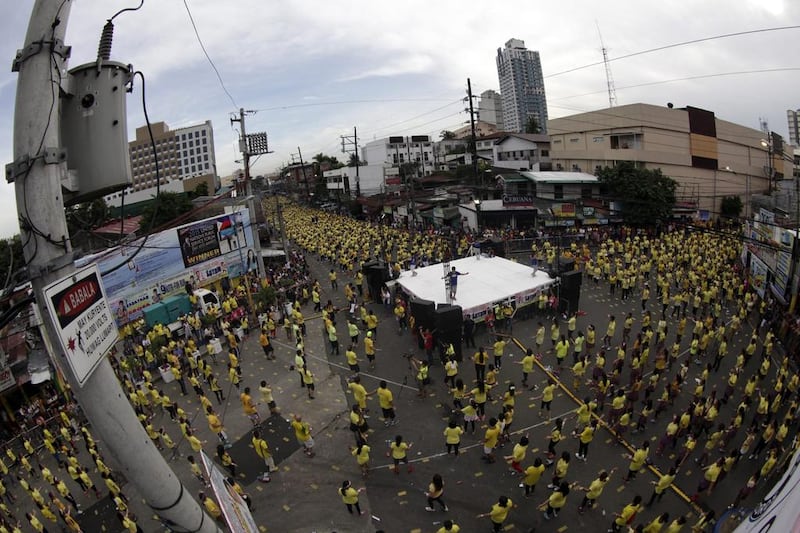 Thousands of Filipinos perform in an attempt to break the Guinness World Record for having the largest Zumba class in a street in Mandaluyong city, eastern Manila, Philippines. The Philippines set a new world record for holding the world’s biggest Zumba class after Guinness World Record adjudicator Allan Pixley confirmed at least 12,975 people took part in the Zumba class in Mandaluyong city. Francis R Malasig / EPA