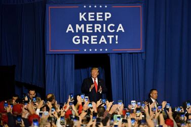 President Donald Trump walks onto the stage during a "Keep America Great" campaign rally at BancorpSouth Arena on November 1, 2019 in Tupelo, Mississippi. AFP