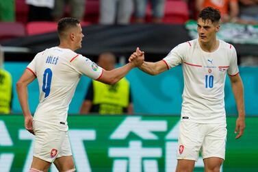 Czech Republic's Patrik Schick, right, celebrates with Czech Republic's Tomas Holes after scoring his sides second goal during the Euro 2020 soccer championship round of 16 match between Netherlands and Czech Republic at the Ferenc Puskas stadium in Budapest, Hungary, Sunday, June 27, 2021. (AP Photo/Darko Bandic, Pool)