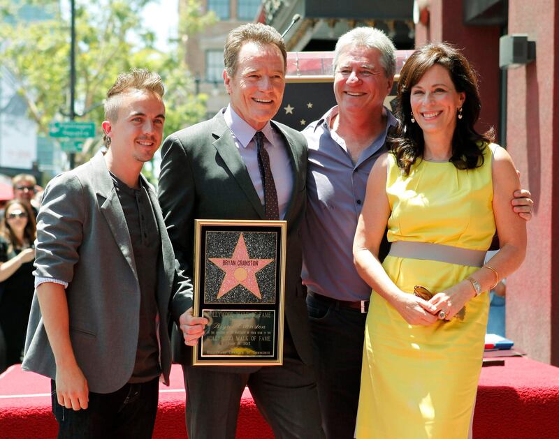 Actor Bryan Cranston (2nd L) poses with his co-stars from the comedy series "Malcolm in the Middle" actor Frankie Muniz (L), series writer Linwood Boomer and actress Jane Kaczmarek during ceremonies unveiling his star on the Hollywood Walk of Fame in Hollywood July 16, 2013. Cranston currently stars in the AMC drama series "Breaking Bad." REUTERS/Fred Prouser 
(UNITED STATES - Tags: ENTERTAINMENT) *** Local Caption ***  LAB13_USA-_0716_11.JPG