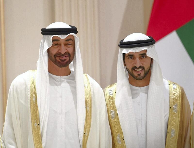 Sheikh Mohamed bin Zayed, Crown Prince of Abu Dhabi and Deputy Supreme Commander of the Armed Forces, stands for a photo with a groom, Sheikh Hamdan bin Mohammed, Crown Prince of Dubai, on Thursday. Courtesy Dubai Media Office