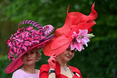 epa09279161 Race-goers wear decorative hats as they attend day three of Royal Ascot in Ascot, Britain, 17 June 2021. Royal Ascot is Britain's most valuable horse race meeting and social event running daily from 15 to 19 June 2019. EPA/NEIL HALL