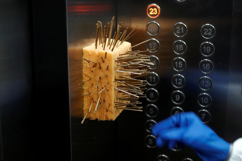 A sponge with toothpicks is seen inside a lift to prevent people from touching the lift buttons with their bare hands at a residential building in Mumbai, India. Reuters