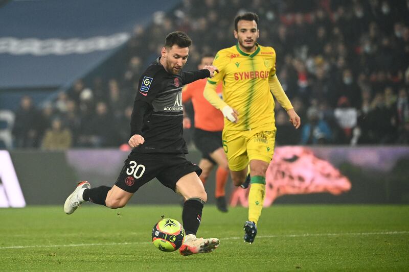 Paris Saint-Germain's Argentinian forward Lionel Messi kicks the ball. AFP