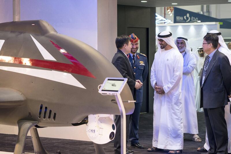 ABU DHABI, UNITED ARAB EMIRATES - February 27, 2018: HH Sheikh Mohamed bin Zayed Al Nahyan, Crown Prince of Abu Dhabi and Deputy Supreme Commander of the UAE Armed Forces (center R), visits the CATIC stand while touring the Unmanned Systems Exhibtion and Conference (UMEX) 2018 at the Abu Dhabi National Exhibition Centre (ADNEC). 
( Ryan Carter for the Crown Prince Court - Abu Dhabi )
---
