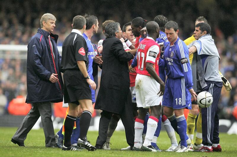 CARDIFF, UNITED KINGDOM - FEBRUARY 25: Arsenal Manager Arsene Wenger (L) and Chelsea Manager Jose Mourinho come on to the pitch to try and calm the players down during the Carling Cup Final match between Chelsea and Arsenal at the Millennium Stadium on February 25, 2007 in Cardiff, Wales. (Photo by Alex Livesey/Getty Images)