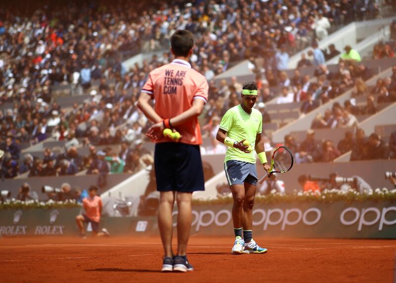 Clay and dust kick up off of the court during the semi-final match. Getty Images