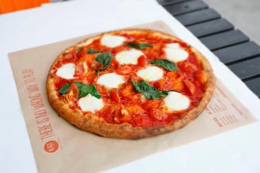 Diners can choose from signature pizzas or build their own. The Red Vine has mozzarella, cherry tomatoes, Parmesan, basil, classic red sauce and a drizzle of extra virgin olive oil. Photo: Blaze Pizza