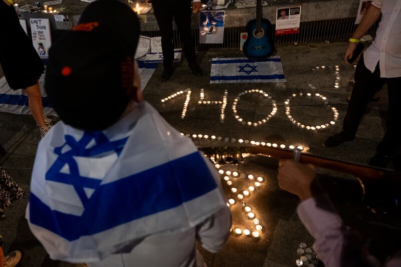 People take part in a candlelight vigil in Dizengoff Square, in Tel Aviv. Getty Images