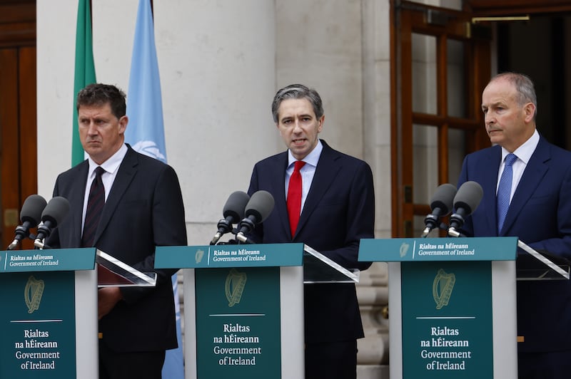 Irish Taoiseach Simon Harris, centre, Foreign Minister Micheal Marti, right, and Environment Minister Eamon Ryan announce that the Republic of Ireland has recognised the state of Palestine. EPA