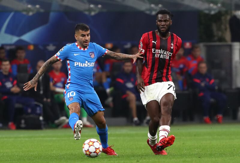 Franck Kessie of AC Milan passes the ball whilst under pressure from Angel Correa of Atletico Madrid. Getty Images