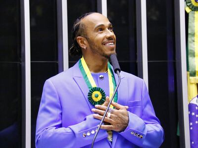 Lewis Hamilton speaks while being awarded the title of Citizen of Honor, during a plenary session of the Chamber of Deputies, in Brasilia, Brazil, 07 November 2022. EPA