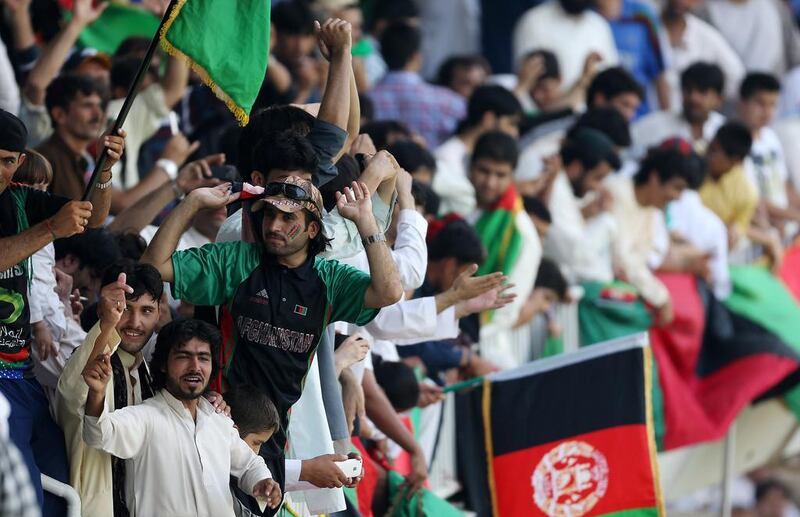 The ICC World Twenty20 Qualifier is being played in front of much lesser crowds than the thousands of Afghanistan fans, above, and the Nepal supporters who are expected to throng the Sharjah Stadium today, despite an inclement weather forecast. Pawan Singh / The National