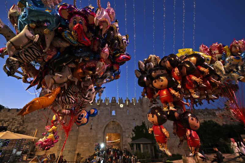 Balloons are displayed in front of the Damascus Gate to mark the end of Ramadan. AFP