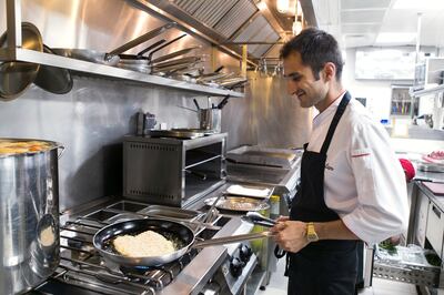 DUBAI, UNITED ARAB EMIRATES, 23 JULY 2017. 

Chef Christian Carrieri, fries the veal, as he prepares a Milanese schnitzel at Matto Restaurant.

(Photo by Reem Mohammed / The National)

Reporter: Saeed Saeed
Section: AC
