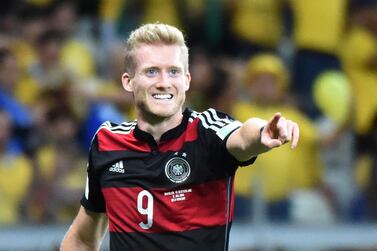 (FILES) In this file photo taken on July 08, 2014 Germany's forward Andre Schuerrle celebrates after scoring during the semi-final football match between Brazil and Germany at The Mineirao Stadium in Belo Horizonte during the 2014 FIFA World Cup. Germany winger Andre Schuerrle on July 17, 2020 announced his retirement, aged just 29, as the 2014 World Cup winner opened up on his experiences of professional football. On July 15, 2020 , Borussia Dortmund had cancelled his contract by mutual consent with a year left to run and Schuerrle says the decision to retire "has long been maturing in me". / AFP / Christophe SIMON