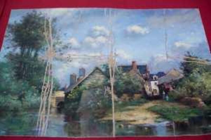 Driebergen, Netherlands. Stolen and damaged painting by Paul Desirere Trouillebert "Landscape with fisherman at a water mill" (please note that there are accents on the spelling of this French name) shown at a police press conference.  Courtesy Rien Zilvold