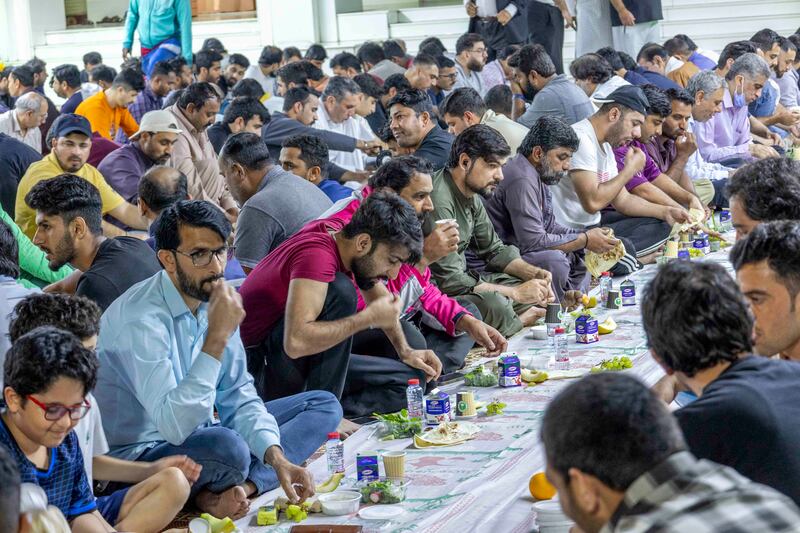 Worshippers break fast at Imam Hussein Mosque in Al Satwa, Dubai. Leslie Pableo for The National