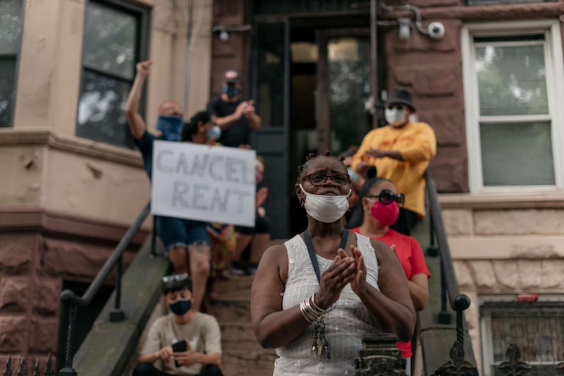 NEW YORK, NY - JULY 31: Housing activists gather to protest alleged tenant harassment by a landlord and call for cancellation of rent in the Crown Heights neighborhood on July 31, 2020 in Brooklyn, New York. Since the onset of the coronavirus crisis, millions of Americans have fallen behind on rent payments, leading many to speculate that an eviction crisis and drastic rise in homelessness is inevitable unless drastic action is taken by state and federal lawmakers.   Scott Heins/Getty Images/AFP
== FOR NEWSPAPERS, INTERNET, TELCOS & TELEVISION USE ONLY ==
