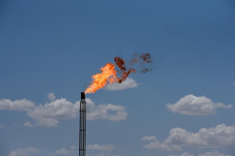 FILE PHOTO: A flare burns off excess gas from a gas plant in the Permian Basin oil production area near Wink, Texas U.S. August 22, 2018. Picture taken August 22, 2018. REUTERS/Nick Oxford/File Photo