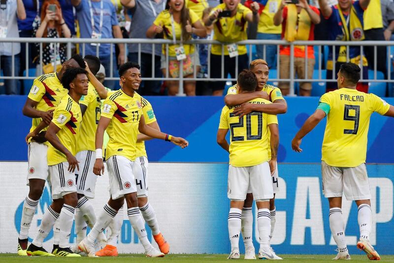 Colombia's players celebrate after team mate Yerry Mina scored his side's opening goal during the group H match between Senegal and Colombia, at the 2018 soccer World Cup in the Samara Arena in Samara, Russia, Thursday, June 28, 2018. (AP Photo/Efrem Lukatsky)