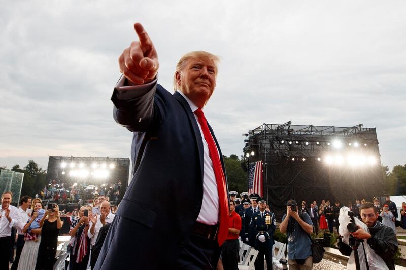 President Donald Trump points to the cheering crowd as he leaves an Independence Day celebration in front of the Lincoln Memorial, Thursday, July 4, 2019, in Washington. AP Photo/Carolyn Kaster