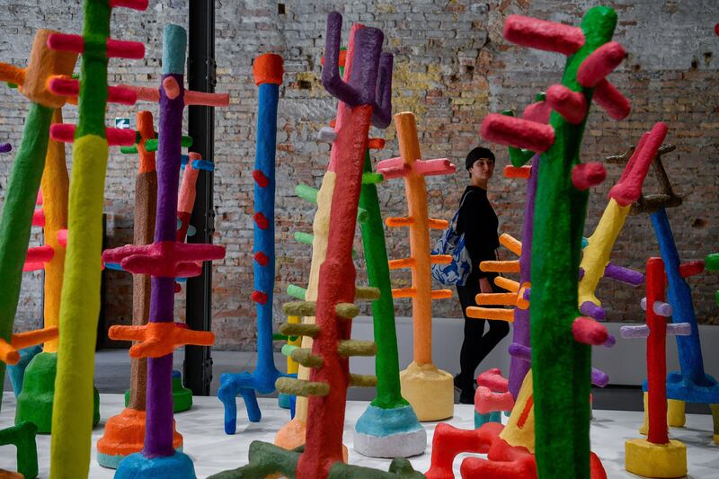 A visitor looks at the installation of Mohamed Ahmed Ibrahim of the UAE at the 59th International Art Exhibition in Venice, Italy, 20 April 2022 (issued 21 April 2022).  The international contemporary art exhibition 'La Biennale di Venezia' runs from 23 April to 27 November 2022.   EPA / Zsolt Czegledi HUNGARY OUT