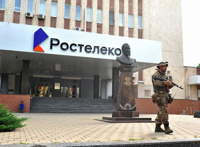 A serviceman from private military company Wagner Group blocks the access to the Rostelecom building in Rostov-on-Don, southern Russia. EPA