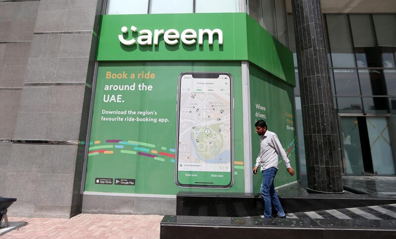 epa07490624 A man walks in front of Careem App advertisement in Dubai, United Arab Emirates, 07 April 2019. Reports in March 2019 state a 3.1 billion USD merger deal was signed between USA-based Uber and Dubai-based competitor Careem that will be completed in seven to eight months.  EPA/ALI HAIDER