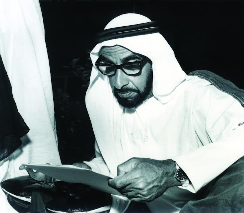 Sheikh Zayed pores over an official document