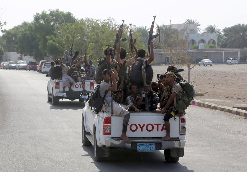 Yemeni Shiite Huthi rebel fighters are pictured in the port city of Hodeidah on December 29, 2018, as the beginning of their pull back from the Red Sea port was announced.   Yemeni rebels have begun to withdraw from the lifeline port of Hodeida, under an agreement reached in Sweden earlier this month, a UN official said today.  / AFP / ABDO HYDER
