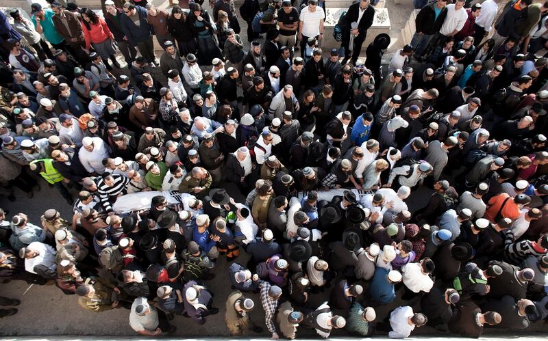 epa02631753 Mourners carry the bodies of Ehud Fogel, 36, his wife Ruth, 35, and their children 11-year-old Yoav, 4-year-old Elad, and 3-month-old Hadasin during their funeral in Jerusalem, on 13 March 2011. The Jewish couple and three of their children were stabbed to death in bed in the Israeli Jewish West Bank settlement of Itamar.  EPA/OLIVER WEIKEN *** Local Caption ***  02631753.jpg