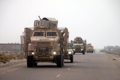 epa06803032 Yemeni forces backed by the Saudi-led coalition gather near the outskirts of the western port city of Hodeidah, Yemen, 12 June 2018. According to reports, the Saudi-led military coalition and Yemeni government forces continue to send reinforcements toward the port city of Hodeidah, preparing to launch an assault on the Houthis-controlled main port of Yemen.  EPA/NAJEEB ALMAHBOOBI