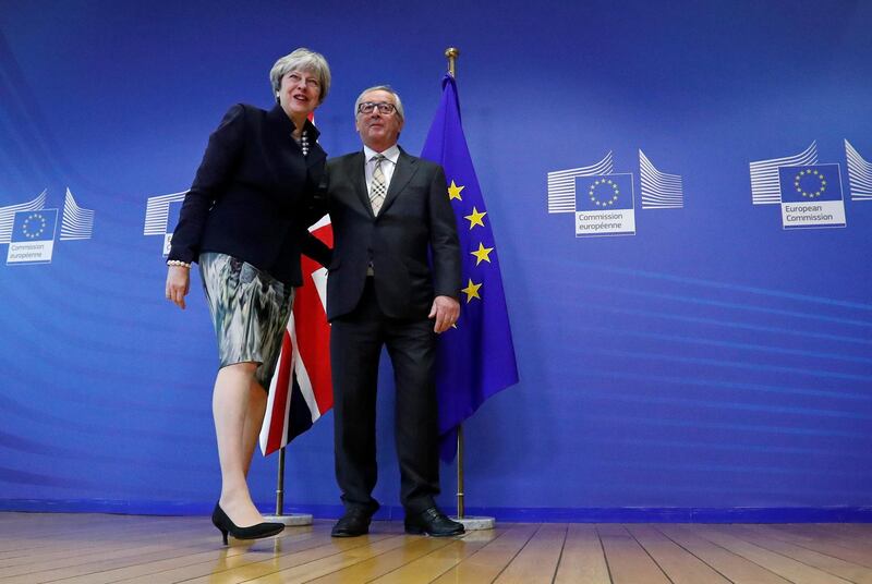 Britain's Prime Minister Theresa May is welcomed by European Commission President Jean-Claude Juncker at the EC headquarters in Brussels, Belgium December 4, 2017. REUTERS/Yves Herman