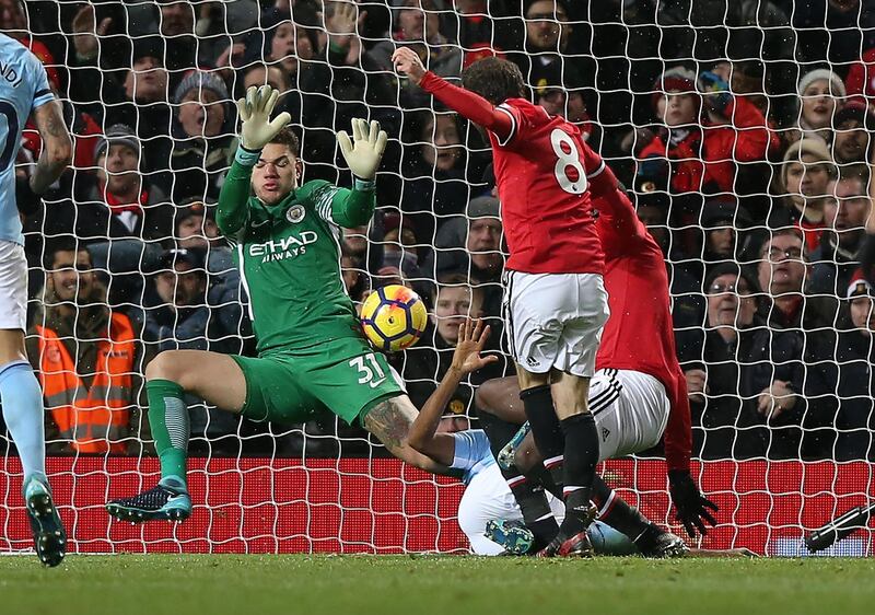 epa06381891 Manchester City's Ederson makes a double save from Manchester United's Zlatan Ibrahimovic (R) and Juan Mata (2ndR) during the English premier league soccer match between Manchester united and Manchester City at Old Trafford Stadium in Manchester, Britain, 10 December 2017.  EPA/Nigel Roddis EDITORIAL USE ONLY. No use with unauthorized audio, video, data, fixture lists, club/league logos or 'live' services. Online in-match use limited to 75 images, no video emulation. No use in betting, games or single club/league/player publications