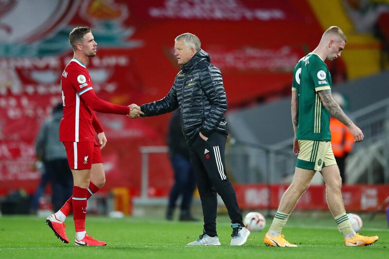 LIVERPOOL, ENGLAND - OCTOBER 24: Jordan Henderson of Liverpool shakes hands with Chris Wilder, Manager of Sheffield United following the Premier League match between Liverpool and Sheffield United at Anfield on October 24, 2020 in Liverpool, England. Sporting stadiums around the UK remain under strict restrictions due to the Coronavirus Pandemic as Government social distancing laws prohibit fans inside venues resulting in games being played behind closed doors. (Photo by Michael Steele/Getty Images)